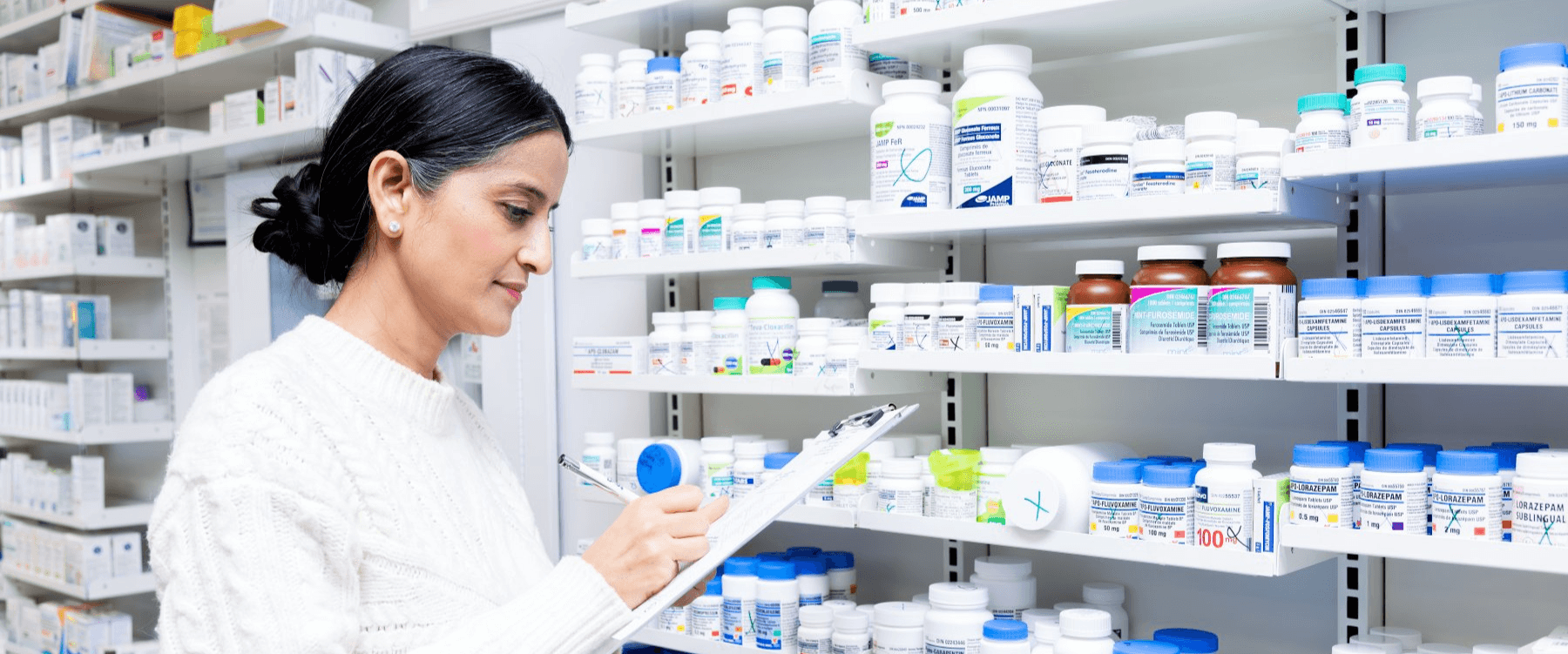 Preet Sidhu reviewing medications at Longfields Pharmacy